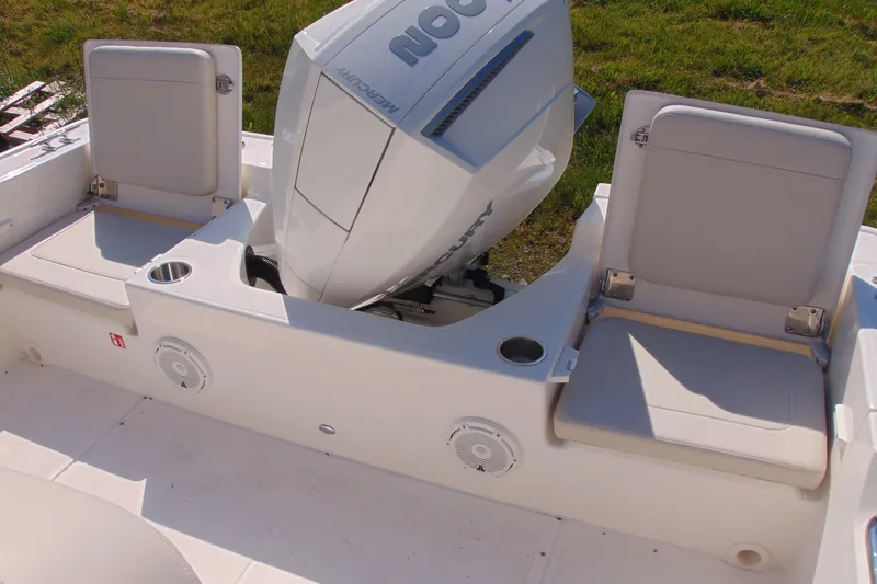 Slide: The Image of 2026 Boston Whaler 210 Montauk boat interior with Mercury engine and seating. - 5