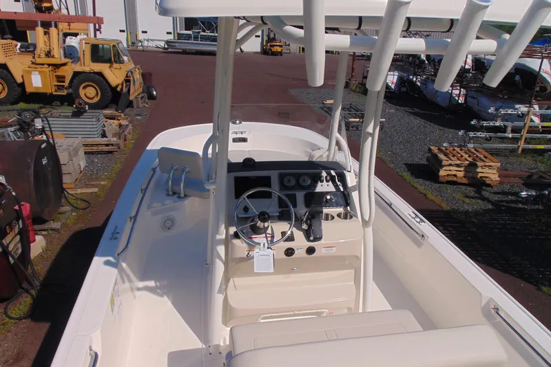 Slide: The Image of 2026 Boston Whaler 210 Montauk boat interior with steering console and equipment. - 7
