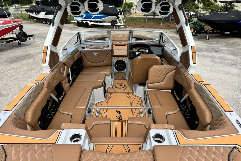 Slide: The Image of Luxurious interior of 2026 Tigé 24RZX boat with tan leather seating and modern design. - 10