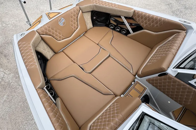 Slide: The Image of Luxurious interior of 2026 Tigé 24RZX boat with tan leather seating and diamond stitching. - 13