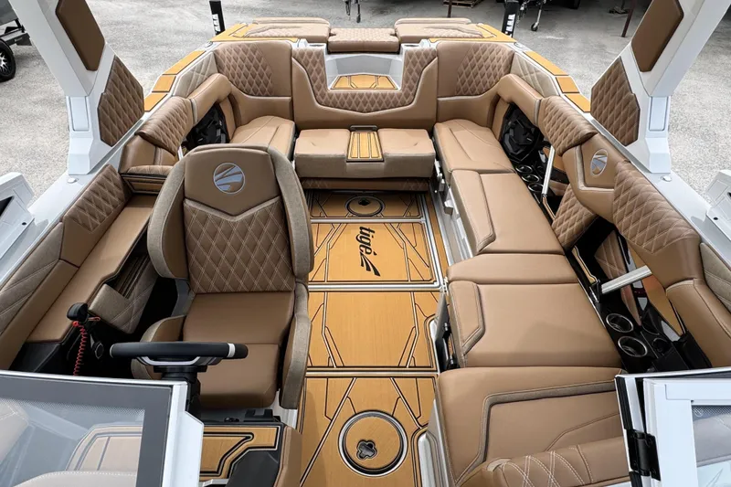 Slide: The Image of Luxurious interior of 2026 Tigé 24RZX boat with tan leather seating and stylish design. - 14