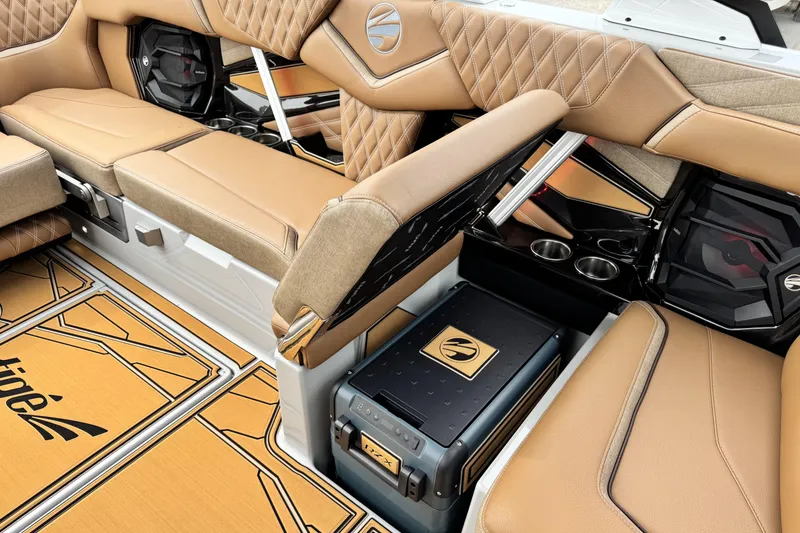 Slide: The Image of Luxurious interior of 2026 Tigé 24RZX boat with tan leather seating and storage. - 15