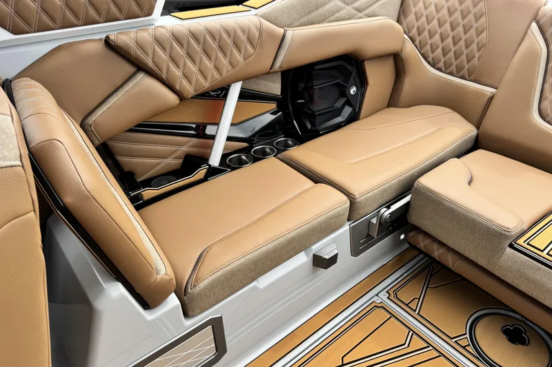 Slide: The Image of Luxurious interior of 2026 Tigé 24RZX boat with tan leather seating and stylish design. - 16