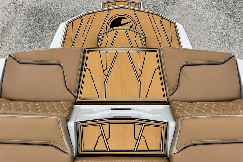 Slide: The Image of 2026 Tigé 24RZX boat interior with tan leather seats and stylish wood paneling. - 17