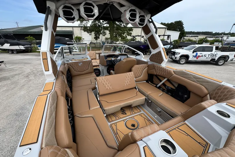 Slide: The Image of 2026 Tigé 24RZX boat interior with luxurious tan seating and modern design features. - 19