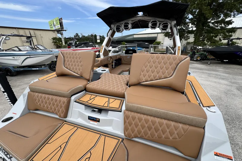 Slide: The Image of 2026 Tigé 24RZX boat with luxurious tan seating and modern design features. - 20