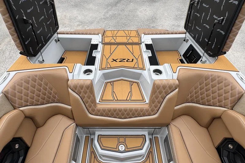 Slide: The Image of Luxurious interior of 2026 Tigé 24RZX boat with tan quilted seats and storage compartments. - 21