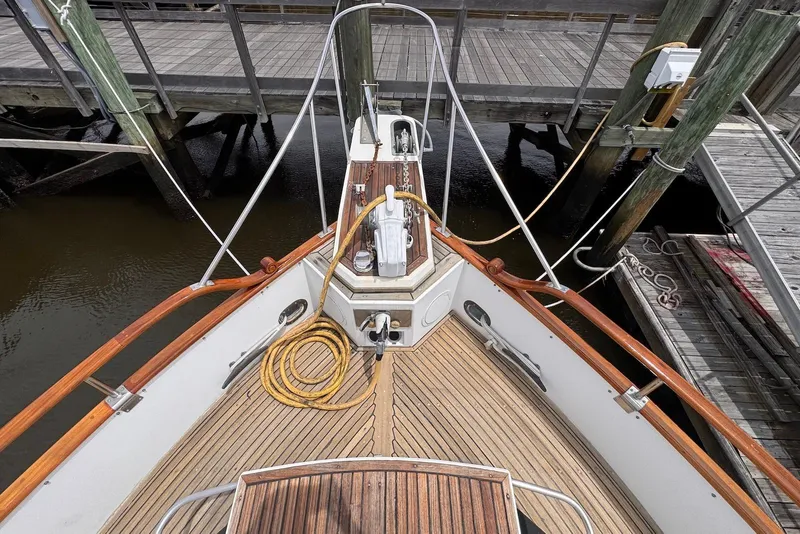 Slide: The Image of Bow view of 1989 Grand Banks 42 Motoryacht docked at a marina. - 12