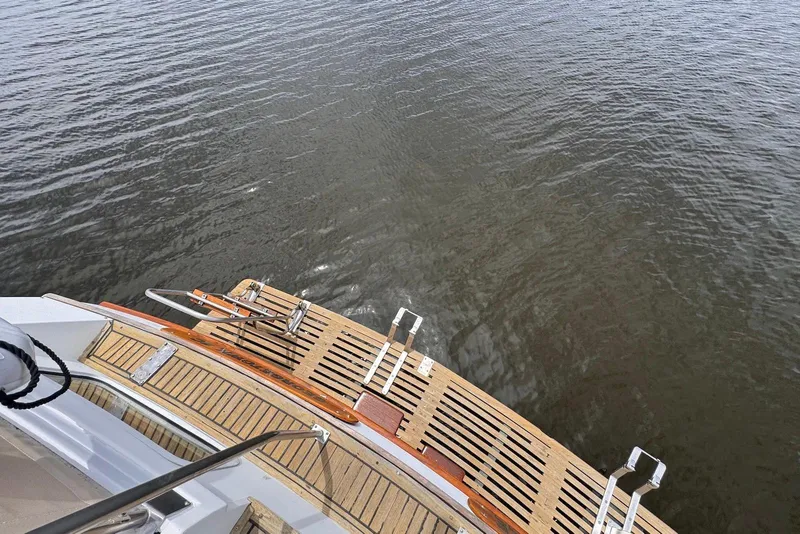 Slide: The Image of Stern view of 1989 Grand Banks 42 Motoryacht with wooden swim platform. - 22
