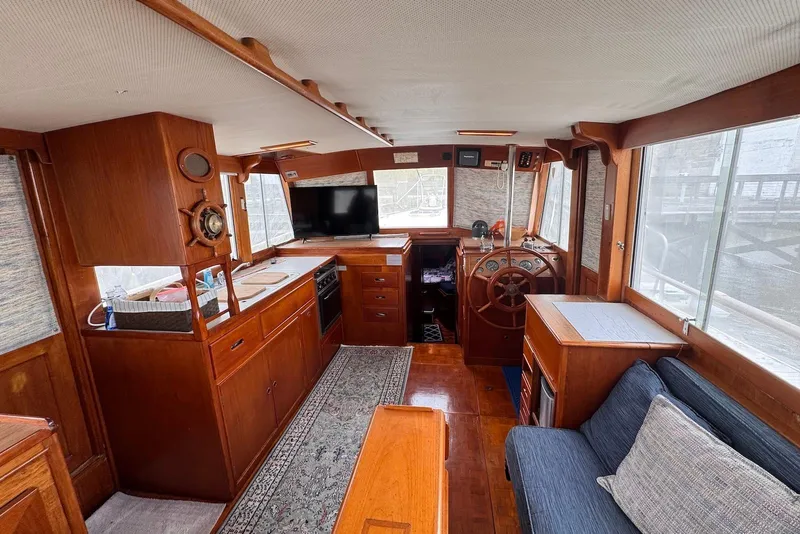 Slide: The Image of Interior of 1989 Grand Banks 42 Motoryacht with wooden finishes and cozy seating area. - 37