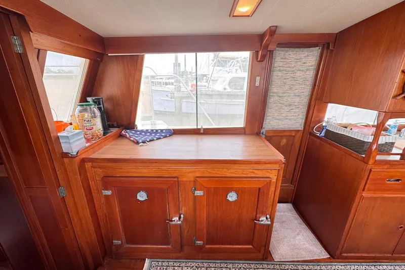 Slide: The Image of Interior of 1989 Grand Banks 42 Motoryacht with wooden cabinetry and nautical decor. - 38