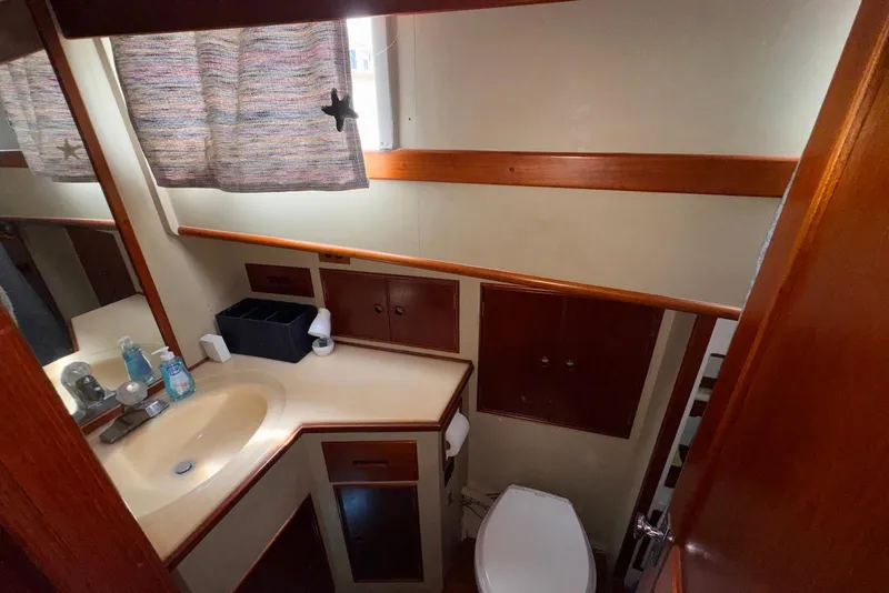Slide: The Image of Bathroom interior of 1989 Grand Banks 42 Motoryacht with sink and toilet. - 43