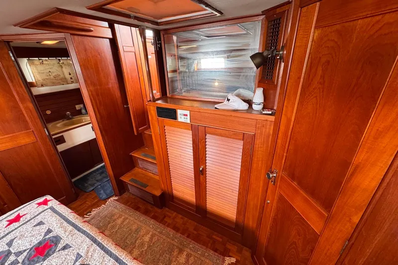 Slide: The Image of Interior of 1989 Grand Banks 42 Motoryacht with wooden cabinetry and cozy decor. - 56