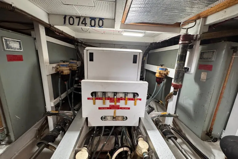 Slide: The Image of Engine room of 1989 Grand Banks 42 Motoryacht with fuel system components and piping. - 62