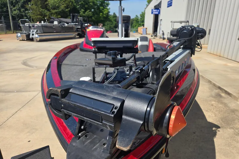 Slide: The Image of 2012 Stratos 189 VLO boat with advanced trolling motor, parked outdoors. - 11
