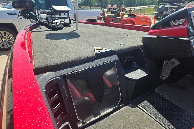 Slide: The Image of Red 2012 Stratos 189 VLO boat interior with carpeted deck and control panel. - 15