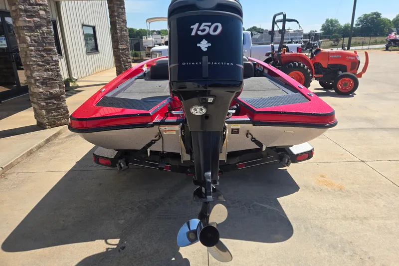 Slide: The Image of 2012 Stratos 189 VLO boat with 150 horsepower engine, parked outdoors. - 4