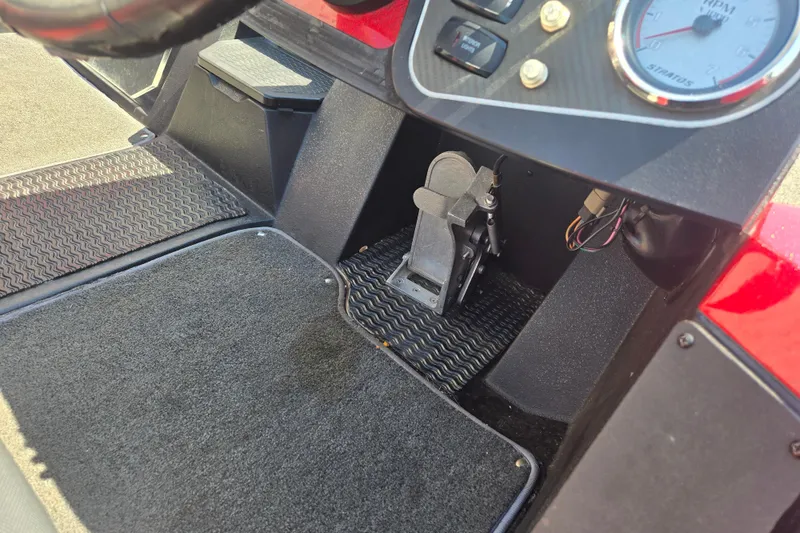 Slide: The Image of Interior view of a 2012 Stratos 189 VLO boat dashboard and foot pedal. - 5