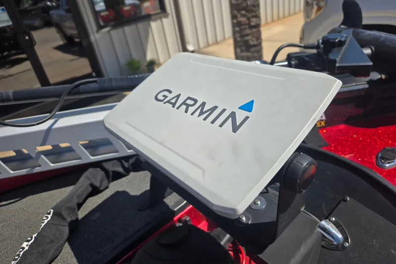 Slide: The Image of Garmin device mounted on a 2012 Stratos 189 VLO boat dashboard. - 9