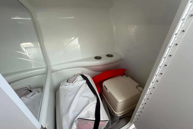 Slide: The Image of Interior of a 2007 Formula 353 FASTech boat with storage and portable toilet. - 11