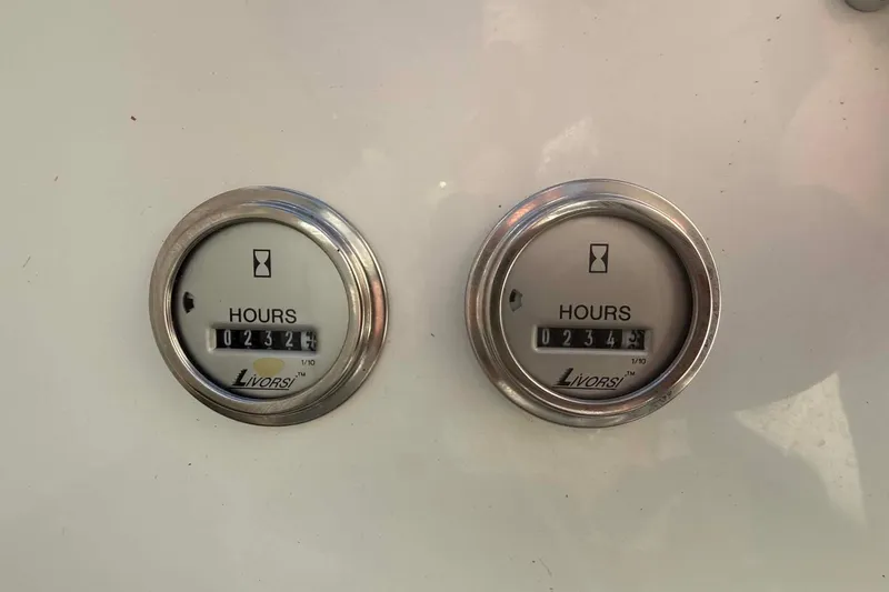Slide: The Image of Hour meters on a 2007 Formula 353 FASTech boat dashboard, displaying 327 and 345 hours. - 15