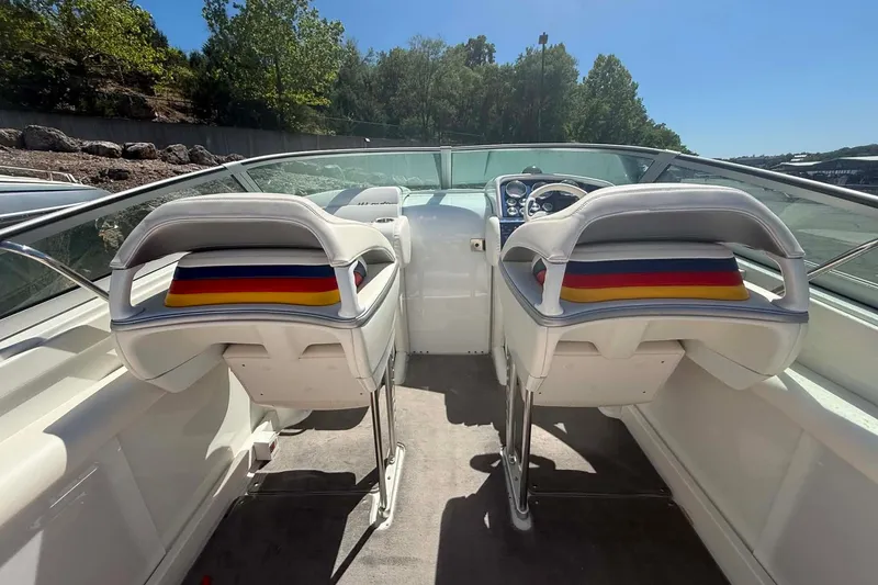 Slide: The Image of 2007 Formula 353 FASTech boat interior with dual white seats and colorful cushions. - 16
