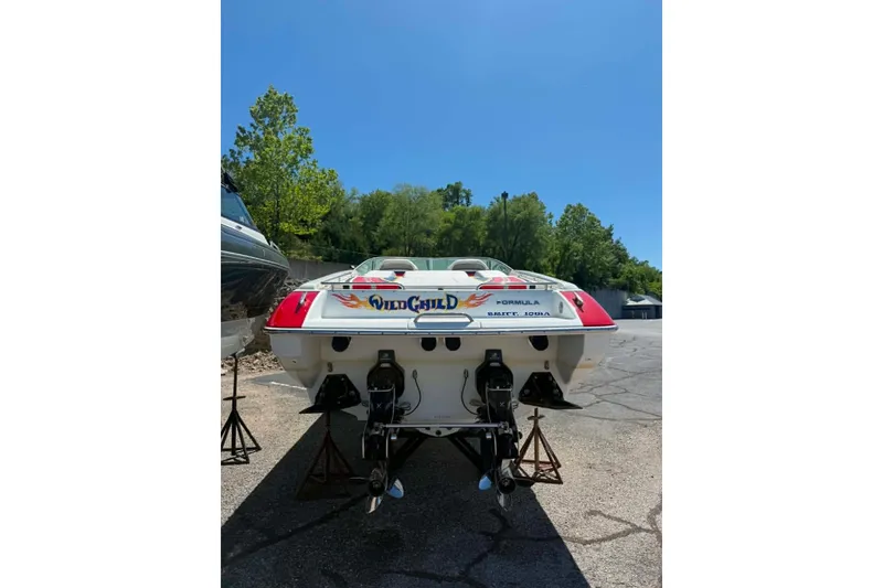 Slide: The Image of 2007 Formula 353 FASTech boat, rear view, on stands, sunny day, trees in background. - 4