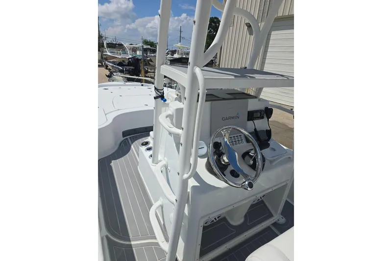 Slide: The Image of 2007 Yellowfin 24 Bay boat console with Garmin navigation system and steering wheel. - 11