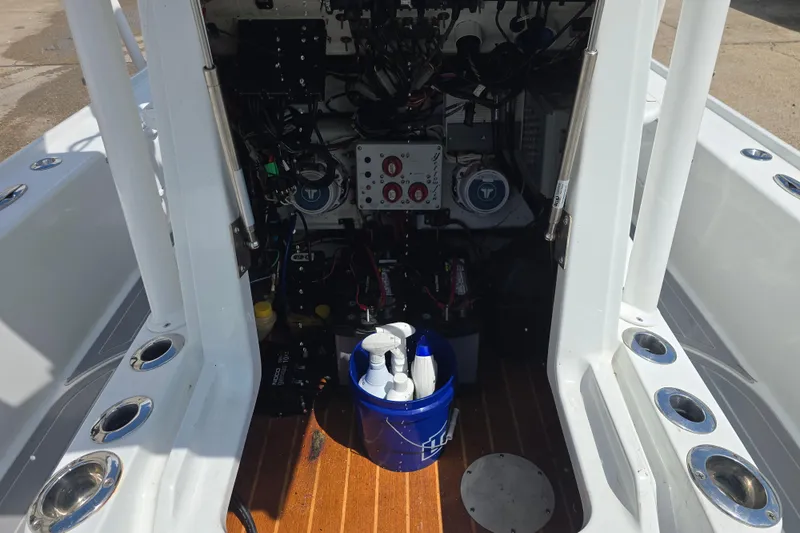 Slide: The Image of Interior view of a 2007 Yellowfin 24 Bay boat showing equipment and cleaning supplies. - 12