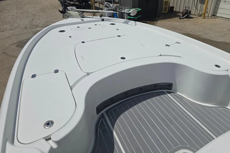 Slide: The Image of 2007 Yellowfin 24 Bay boat deck with storage and measuring tape. - 14