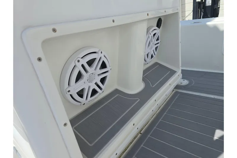 Slide: The Image of Speakers on a 2007 Yellowfin 24 Bay boat, featuring a sleek white design. - 15