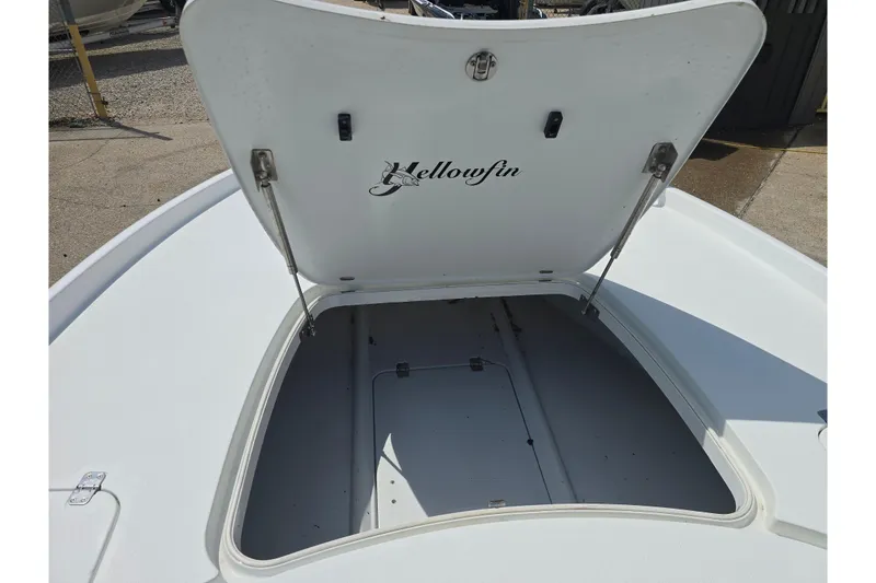 Slide: The Image of Open storage compartment on a 2007 Yellowfin 24 Bay boat, showcasing ample space. - 16