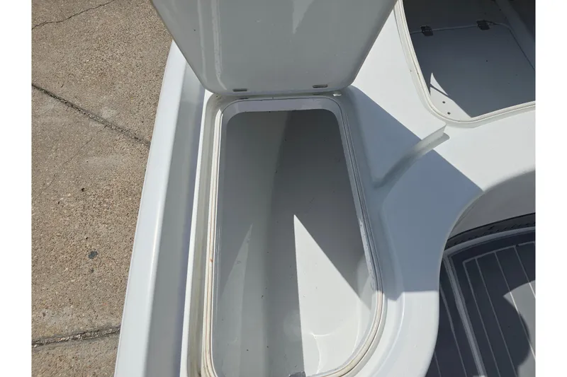 Slide: The Image of Open storage compartment on a 2007 Yellowfin 24 Bay boat deck. - 17