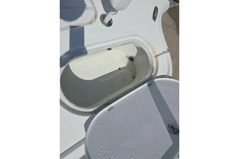 Slide: The Image of Open storage compartment on a 2007 Yellowfin 24 Bay boat, showing interior details. - 22
