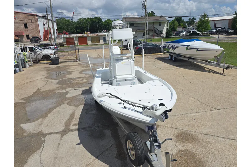 Slide: The Image of 2007 Yellowfin 24 Bay boat on trailer in a parking lot, ready for transport. - 7