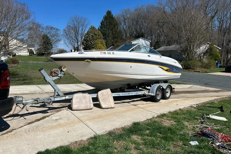Slide: The Image of 2003 Chaparral 21 SSi boat on trailer, parked in suburban driveway. - 3