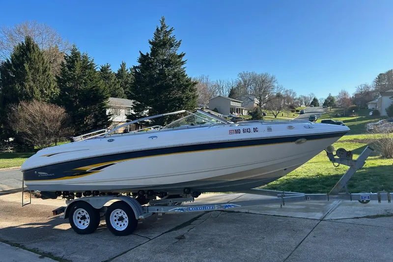 Slide: The Image of 2003 Chaparral 21 SSi boat on trailer, parked in suburban neighborhood driveway. - 4