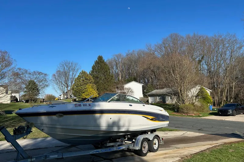 Slide: The Image of 2003 Chaparral 21 SSi boat on trailer in suburban neighborhood driveway. - 6