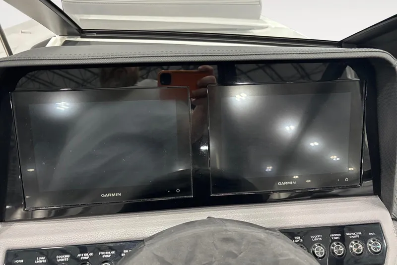 Slide: The Image of Dual Garmin displays on 2026 Cobalt R4 dashboard with control buttons. - 11