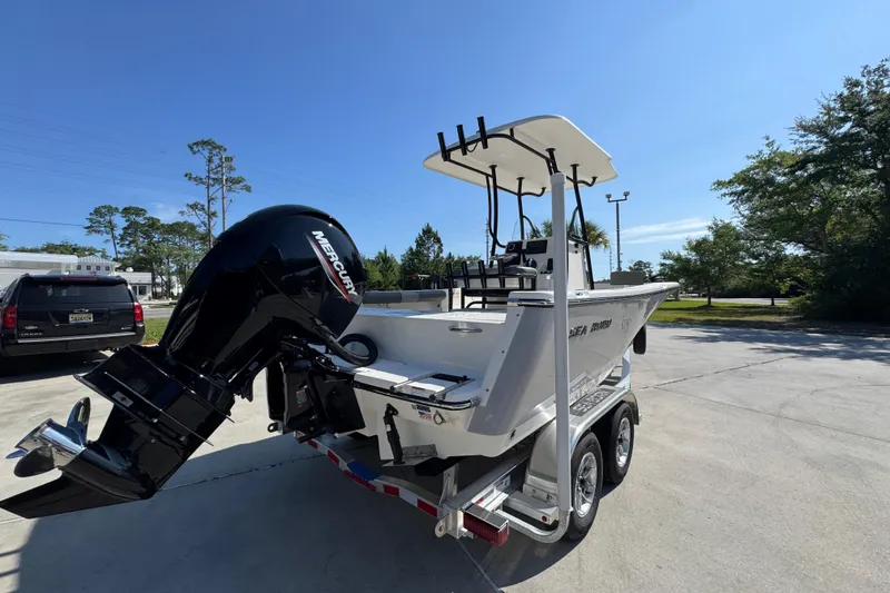 Slide: The Image of 2027 Sea Born LX21 Center Console boat with Mercury engine on trailer. - 10