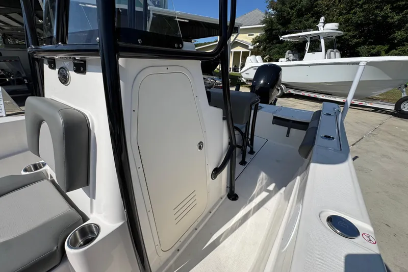 Slide: The Image of 2027 Sea Born LX21 Center Console boat interior with seating and console details. - 21