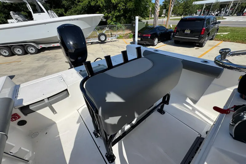 Slide: The Image of 2027 Sea Born LX21 Center Console boat interior with seating and motor view. - 25