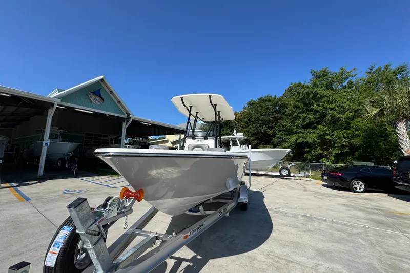 Slide: The Image of 2027 Sea Born LX21 Center Console boat on trailer at dealership. - 4
