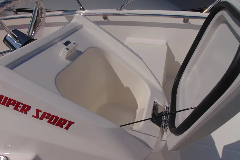 Slide: The Image of 2026 Boston Whaler 160 Super Sport boat storage compartment with open hatch. - 11
