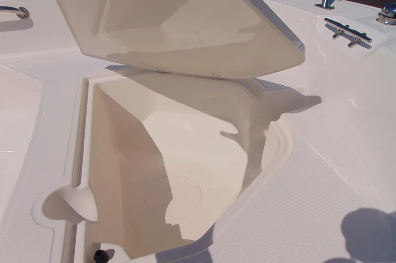 Slide: The Image of Open storage compartment on a 2026 Boston Whaler 160 Super Sport boat. - 12
