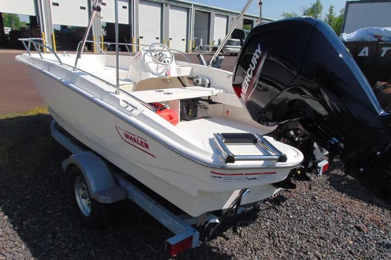 Slide: The Image of 2026 Boston Whaler 160 Super Sport boat with Mercury engine on trailer. - 4