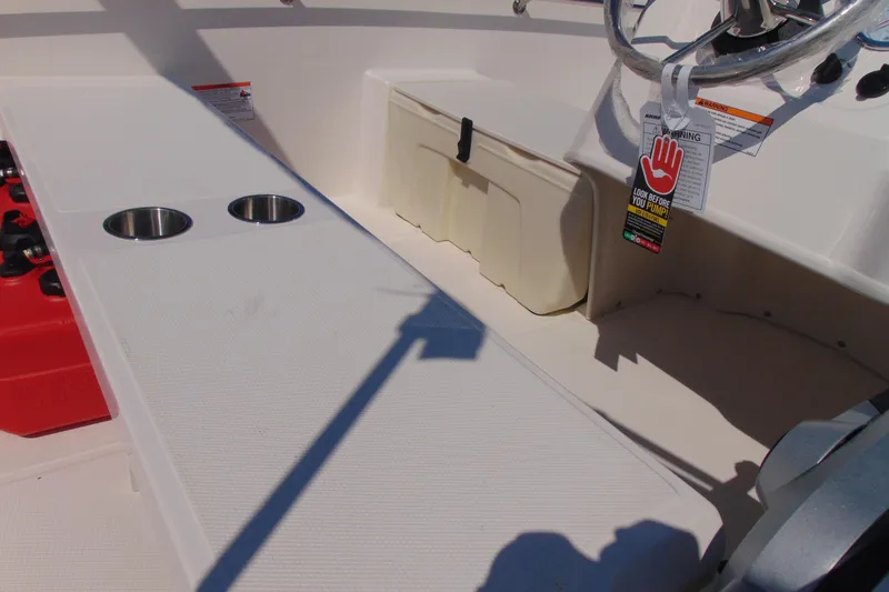 Slide: The Image of Interior of 2026 Boston Whaler 160 Super Sport boat with seating and steering wheel. - 8