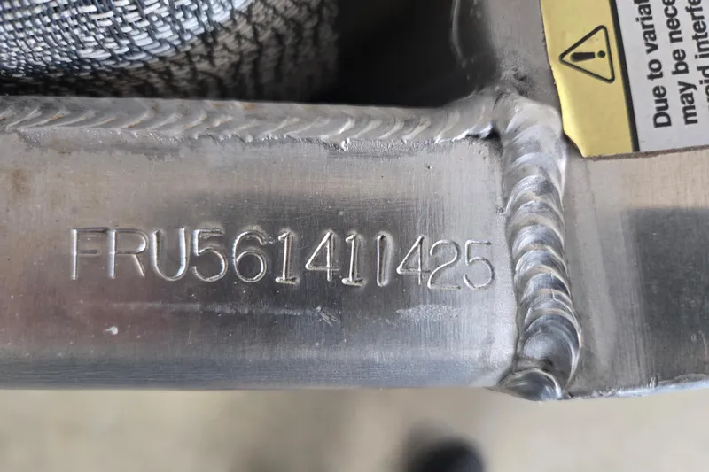 Slide: The Image of Serial number "FRU561411425" on a 2025 Trifecta 20RF LE metal component. - 5