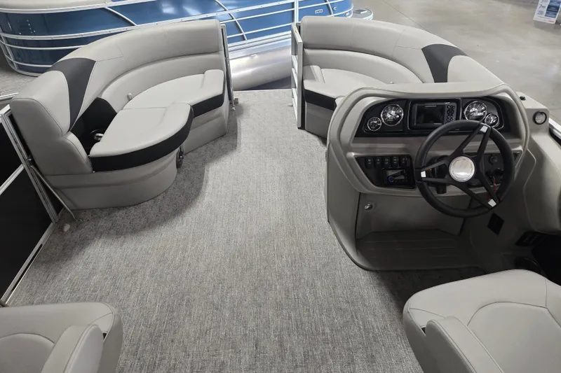 Slide: The Image of Interior of 2025 Trifecta 20RF LE pontoon boat with modern seating and steering console. - 7