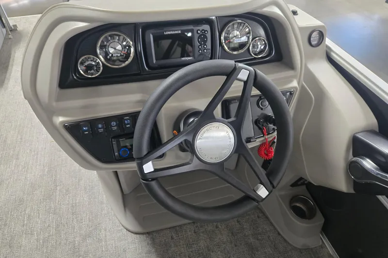 Slide: The Image of Steering console of 2025 Trifecta 20RF LE boat with gauges and controls. - 8